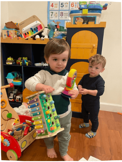Boys playing inside with educational toys at Mama Bear Daycare, daycare in Lake Forest.